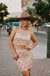 Vegas Nights + Rodeo Lights: The NFR Collection. Two piece chandelier fringe skirt and top paired with cowboy hat. rose gold sequins. 