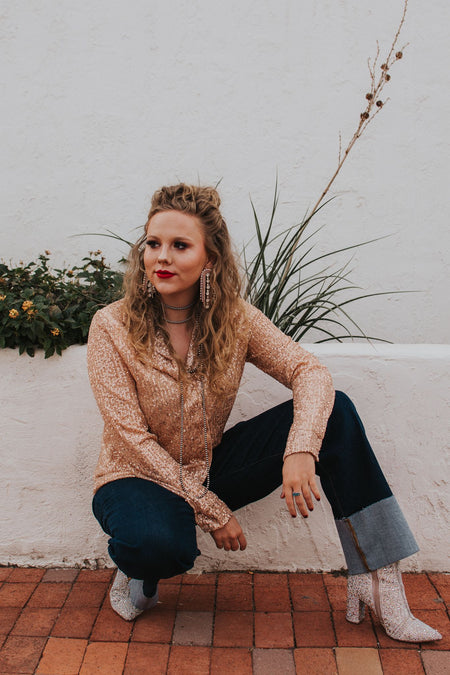 Sparkles? An absolute holiday necessity. Make a statement at this Christmas party in this button down and then keep it around for New Year's too! This blouse has a looser fit and doesn't sacrifice comfort for sparkle- this will be the softest sequin piece in your closet. 