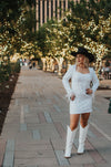 Vegas Nights + Rodeo Lights: The NFR Collection.  white sequin + iridescent sequin midi dress with feather trim.