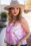 This flattering tank has rows of pink iridescent disc sequins to ensure that every eye will be on you. It has adjustable straps and is the perfect night out top. shop sequin tops near me, boutique near me