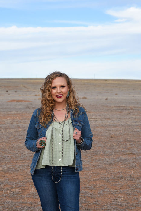 The perfect tanks for spring! These woven knit, square neck tops have adjustable straps and decorative button detailing. They come in two colors, sage and sunshine, but we think there's a chance you might need both.