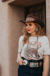 I know what I'm asking Santa for this year! This comfy graphic tee features a buckin' bronco and a festive Christmas tree. It's giving the perfect cowboy Christmas vibes.  Our favorite style pick? Pairing it with our rhinestone cowgirl mesh top to elevate your whole look!