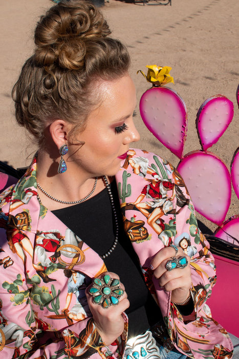 These retro pinup cowgirls are giving us allll the vibes! This blazer has an ultra flattering cut and is handmade in Texas by Silverado Apparel. You won't find a piece this fun and bold anywhere else!   Please note: this item is currently a PREORDER only. 