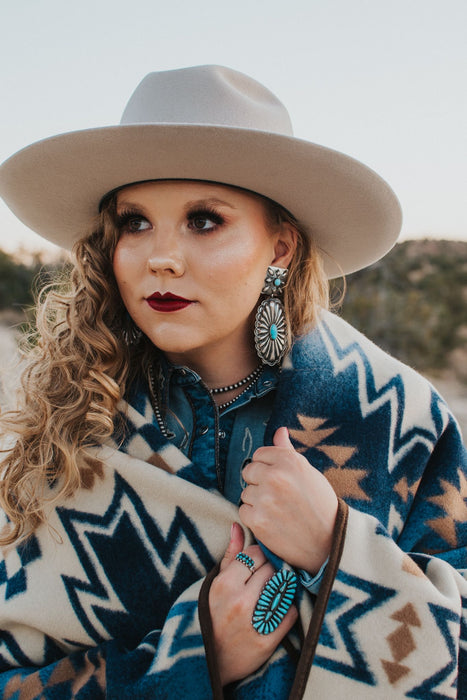 These conchos are as big and beautiful as statement earrings can get! Authentic turquoise and sterling silver, stamped Rita Lee. These conchos are quintessential southwestern style!