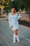 Vegas Nights + Rodeo Lights: The NFR Collection. white sequin + iridescent sequin midi dress with feather trim.