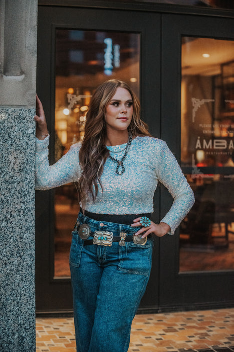 sparkly sequin top! We love these white iridescent sequins- perfect for the National Finals Rodeo, holiday party looks, and more. Slightly cropped hem- amazing nightlife look! 