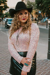 pink iridescent sequin crop top with padded shoulders.