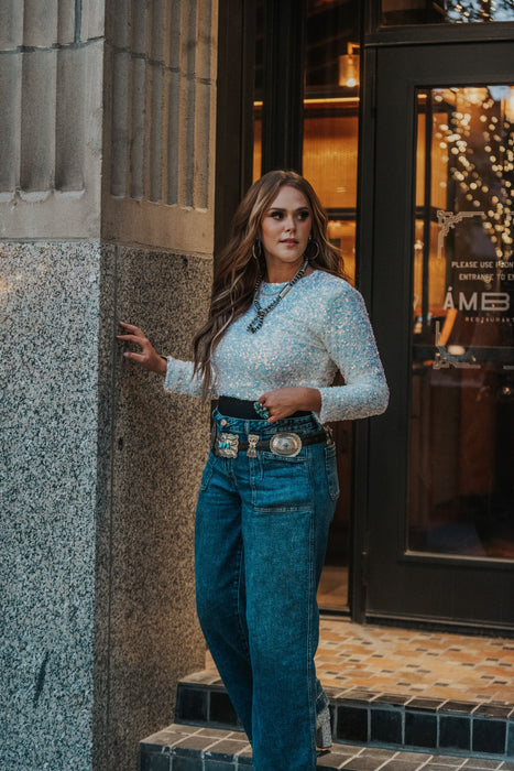 sparkly sequin top! We love these white iridescent sequins- perfect for the National Finals Rodeo, holiday party looks, and more. Slightly cropped hem- amazing nightlife look! 