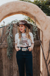 I know what I'm asking Santa for this year! This comfy graphic tee features a buckin' bronco and a festive Christmas tree. It's giving the perfect cowboy Christmas vibes.  Our favorite style pick? Pairing it with our rhinestone cowgirl mesh top to elevate your whole look!