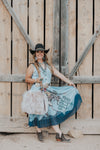 The Tasha Polizzi rodeo club skirt is a stunning chiffon skirt with a retro rodeo club bucking horse design. Designer Tasha Polizzi is based in the Berkshire mountains and creates one of a kind pieces. We love stocking this piece in our western boutique!