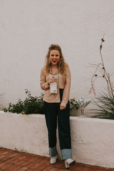 Sparkles? An absolute holiday necessity. Make a statement at this Christmas party in this button down and then keep it around for New Year's too! This blouse has a looser fit and doesn't sacrifice comfort for sparkle- this will be the softest sequin piece in your closet. 