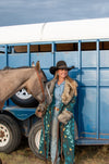 These Tasha Polizzi pieces are the definition of high fashion on the ranch. This peacock Everest blanket coat has a stunning aztec pattern and fur trim on the collar and cuffs, making for a truly one of a kind jacket.