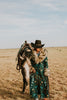 These Tasha Polizzi pieces are the definition of high fashion on the ranch. This peacock Everest blanket coat has a stunning aztec pattern and fur trim on the collar and cuffs, making for a truly one of a kind jacket.