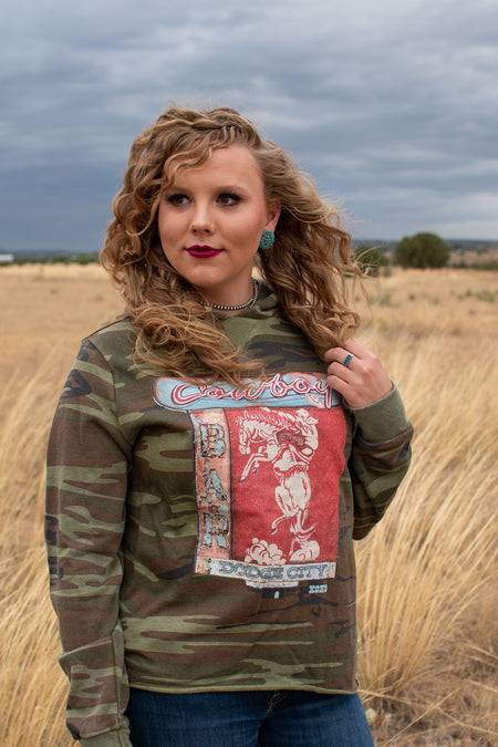 Calling all cowboys... this Dodge City Cowboy Bar hoodie is so stinkin' adorable! Also, we're just going to be living in camo print for the foreseeable future.    Designed by XOXO The Art Company in Texas.