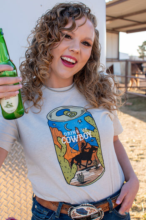 Drink up cowboy! If summer nights spent with cold drinks by the roping arena were a graphic tee, it would definitely be this one.