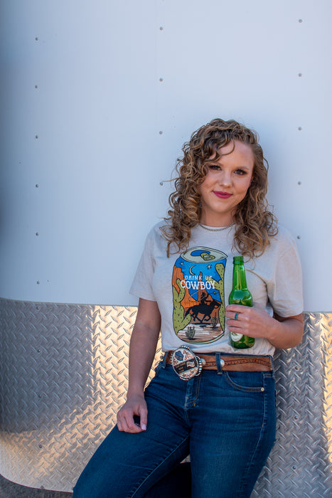 Drink up cowboy! If summer nights spent with cold drinks by the roping arena were a graphic tee, it would definitely be this one.