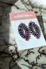 These pink Mojave fishtail clusters couldn't get any dreamier. Stamped and signed Tamara Benally. Mojave turquoise. Mojave turquoise earrings for sale. Cosmic cowgirl clusters. Fishtail Native American style earrings. Third eye Native American cluster Zuni jewelry. Made by Tamara Benally Native American artist. Signed Navajo sterling silver. Pink and purple turquoise. Pink turquoise. Purple turquoise.