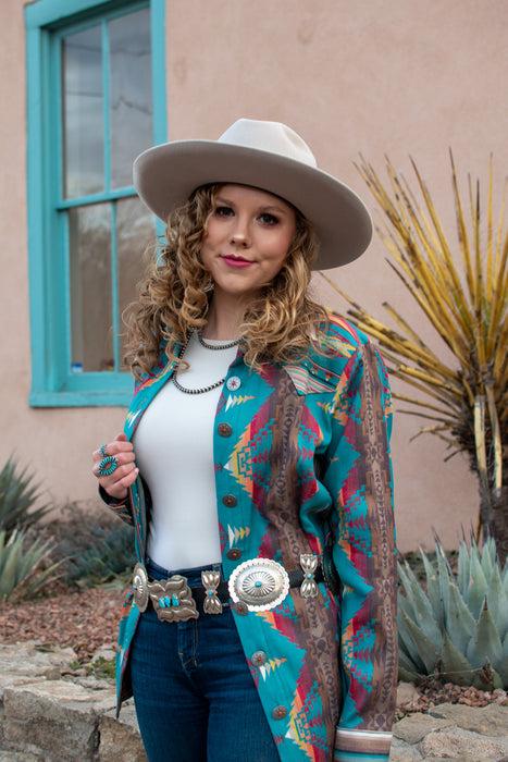 Button down blue serape blouse by Silverado Apparel.  Handmade in Texas.  Silverado Apparel as featured in Cowgirl Magazine.  Silverado clothing.  Silverado clothing for sale, serape style and Caracas Silverado Apparel pattern. 